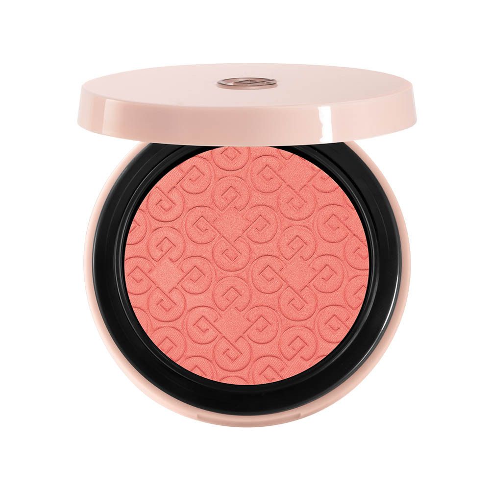 Poudre blush compacte ronde. Boîtier rose avec miroir. Ouvert, produit visible.
