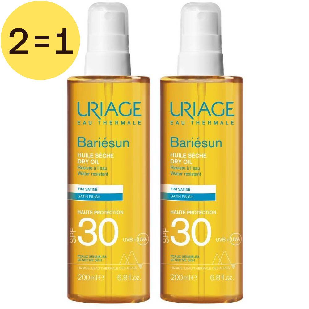 Deux flacons de Uriage Bariésun Huile Sèche SPF30. Liquide jaune en flacons spray à bouchon blanc. Inscription : HAUTE PROTECTION 30.