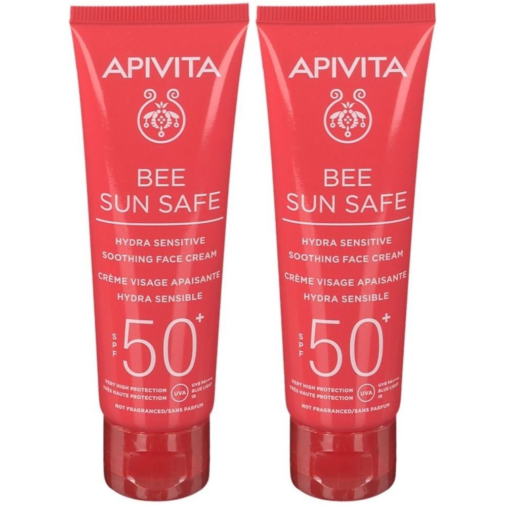 Deux tubes de crème visage Apivita Bee Sun Safe SPF50+. Emballage rouge, texte blanc. Marque et nom du produit visibles.
