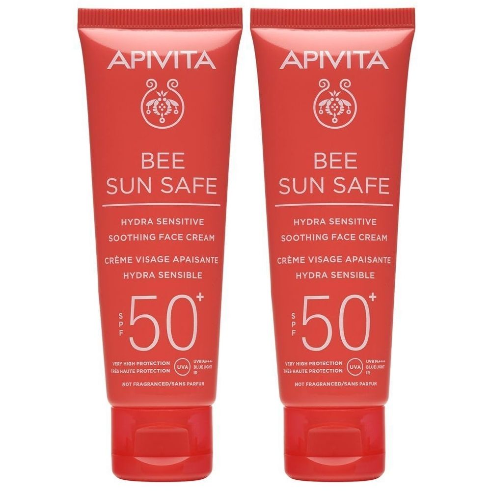 Deux tubes Apivita Bee Sun Safe Hydra Sensitive Soothing Face Cream SPF50. Emballage rouge, texte blanc. SPF 50.