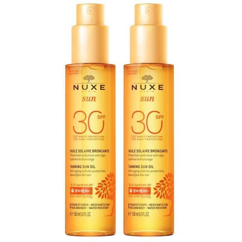 Deux flacons d'huile solaire avec vaporisateur. Inscription : Nuxe Sun, SPF 30. Nom du produit : Huile Solaire Bronzante.