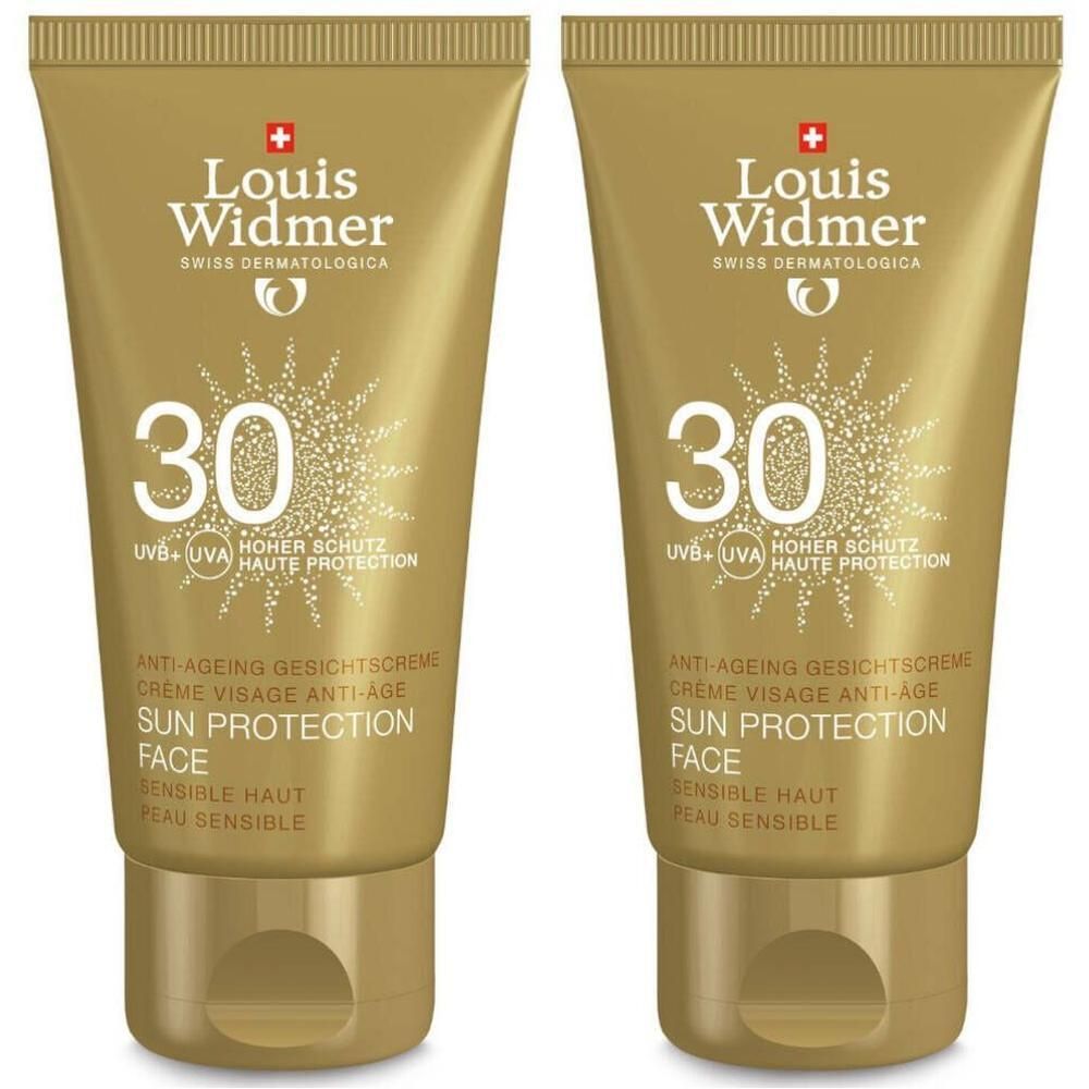 Deux tubes dorés de crème solaire Louis Widmer LSF 30. Texte: Anti-âge, visage, Sun Protection, peau sensible.