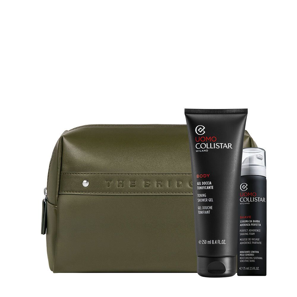 Coffret cadeau avec produits cosmétiques. Comprend une trousse de toilette verte, un gel douche et un rasoir. Tubes noirs avec texte blanc.
