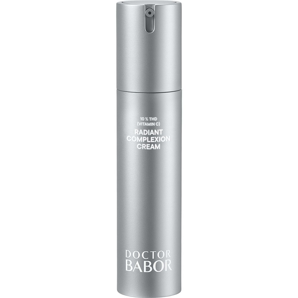 Flacon argenté avec pompe, vue de face. L'étiquette indique "DOCTOR BABOR" et "RADIANT COMPLEXION CREAM".