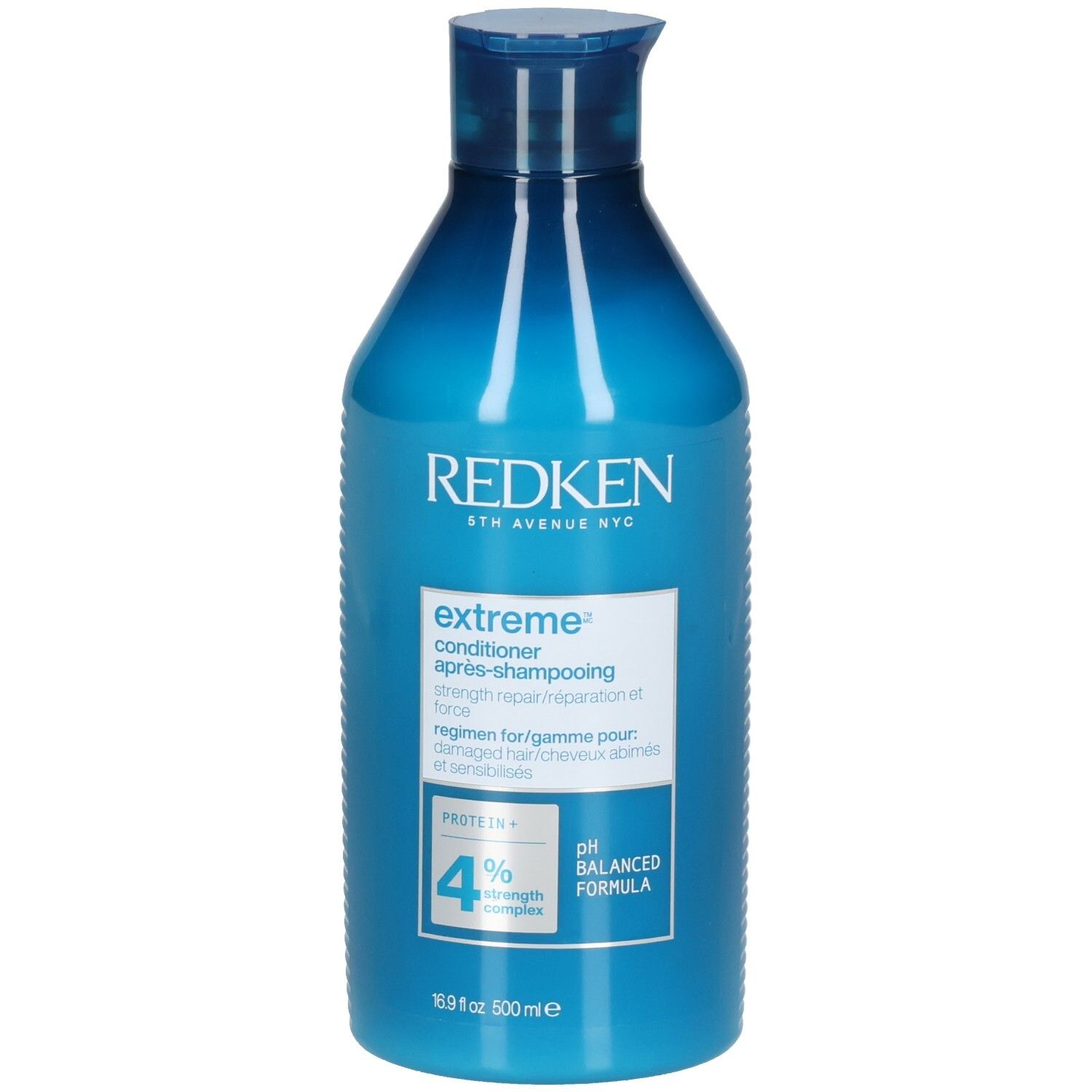Flacon bleu Redken Extreme Conditioner. Contenance 500ml. Inscription: pH Balanced Formula, 4% Strength Complex.