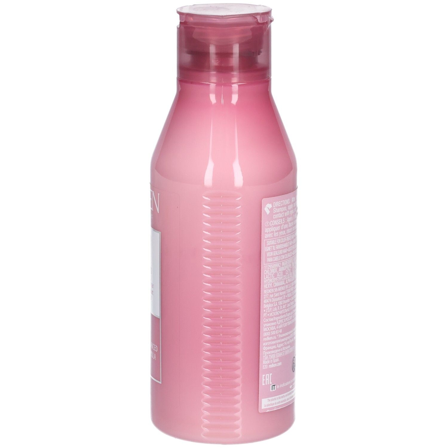 Vue latérale d'un flacon rose avec bouchon rouge. Texte et code-barres sur le flacon.