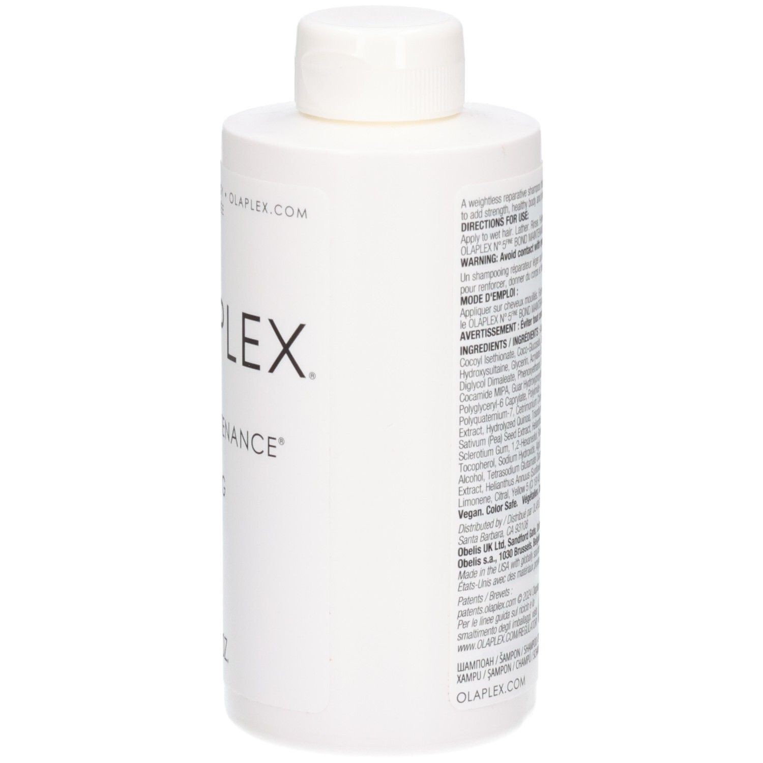 Vue latérale d'une bouteille blanche Olaplex No.4 Fine Bond Maintenance Shampoo avec instructions.