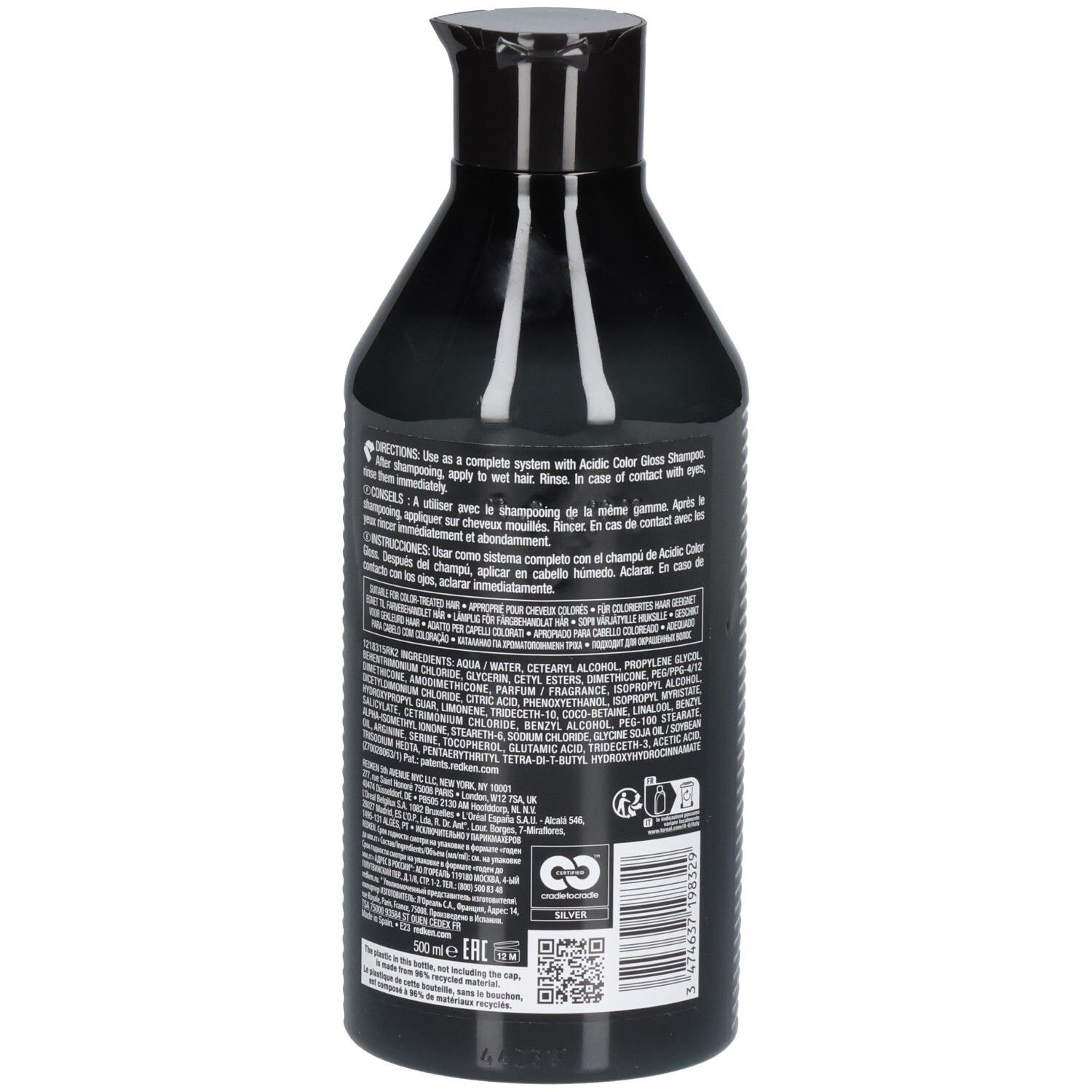 Dos d'un flacon noir. Texte avec ingrédients et instructions. Logo REDKEN et symbole de recyclage.
