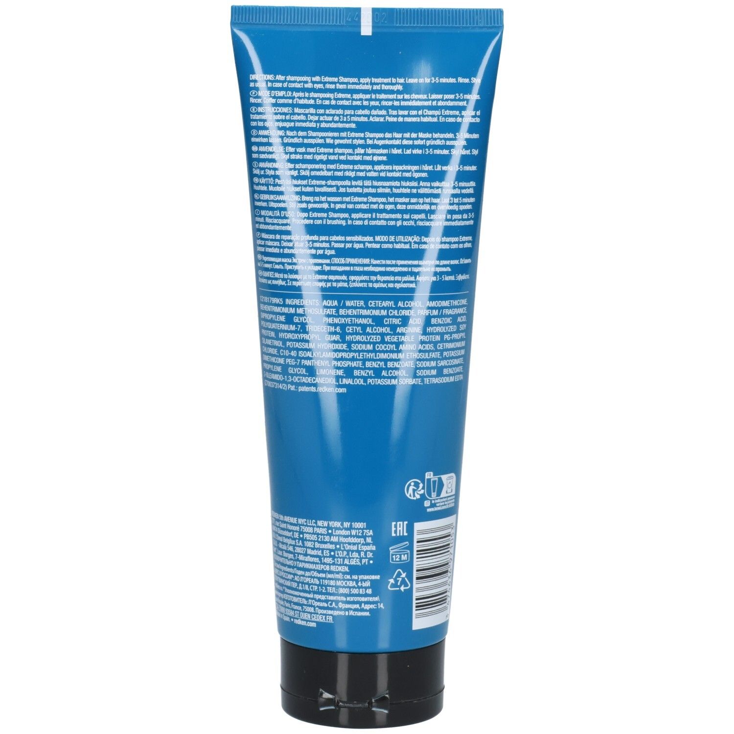 Dos d'un tube bleu avec bouchon noir. Texte multilingue. Code EAN et symboles de recyclage.