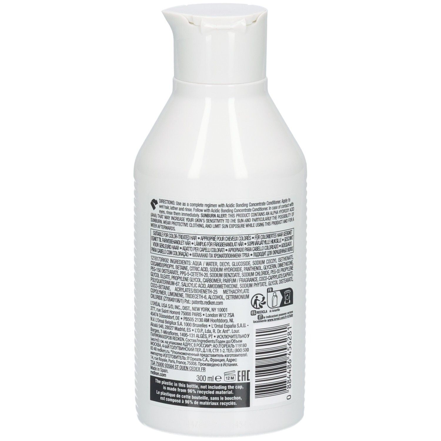 Flacon de shampooing blanc. Dos avec texte et code-barres. Marque : Redken. 300ml.