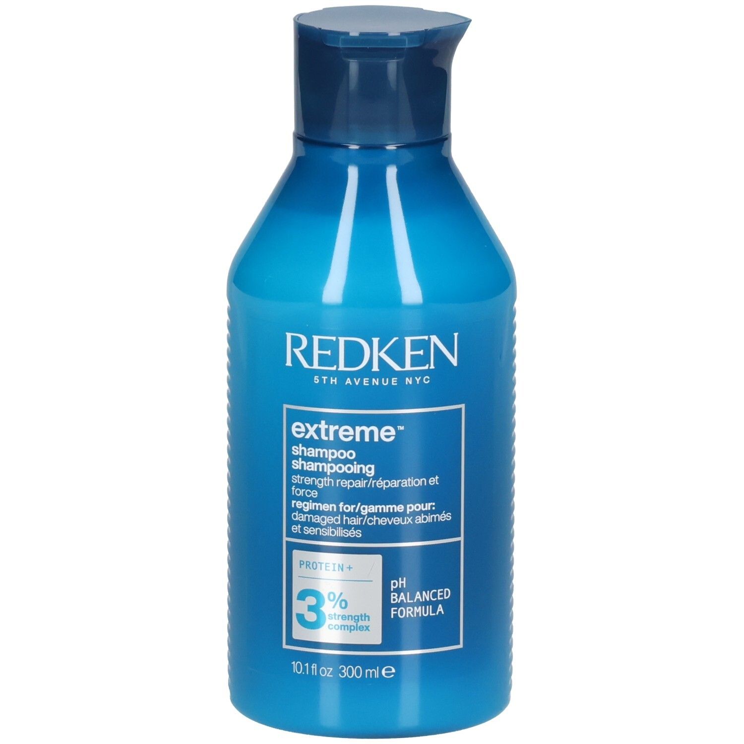 Flacon de shampooing bleu. Inscriptions: Redken, extreme shampoo, 3% strength complex, pH balanced formula. 300ml.