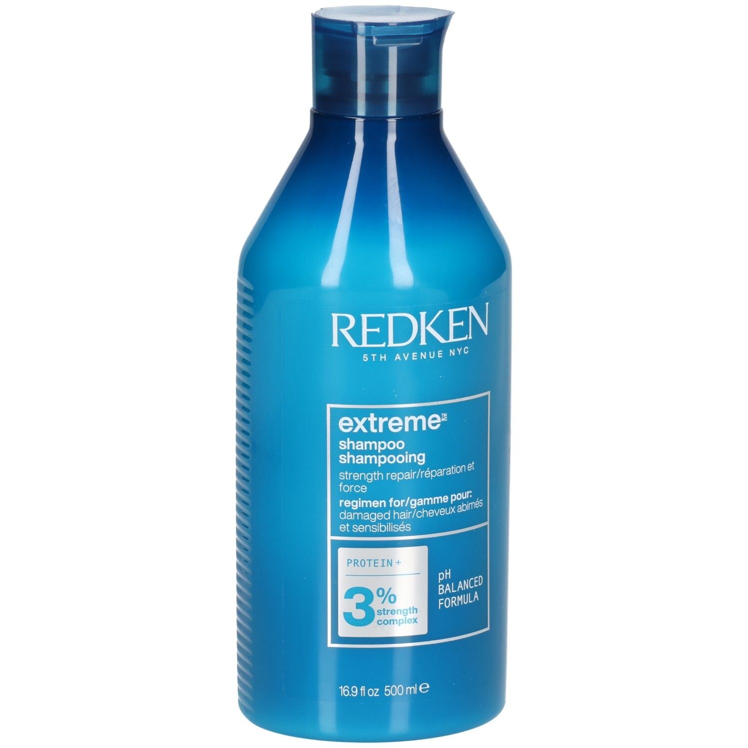 Flacon de shampooing bleu. Inscriptions: Redken, extreme shampoo, 3% strength complex, pH balanced formula. 500ml.