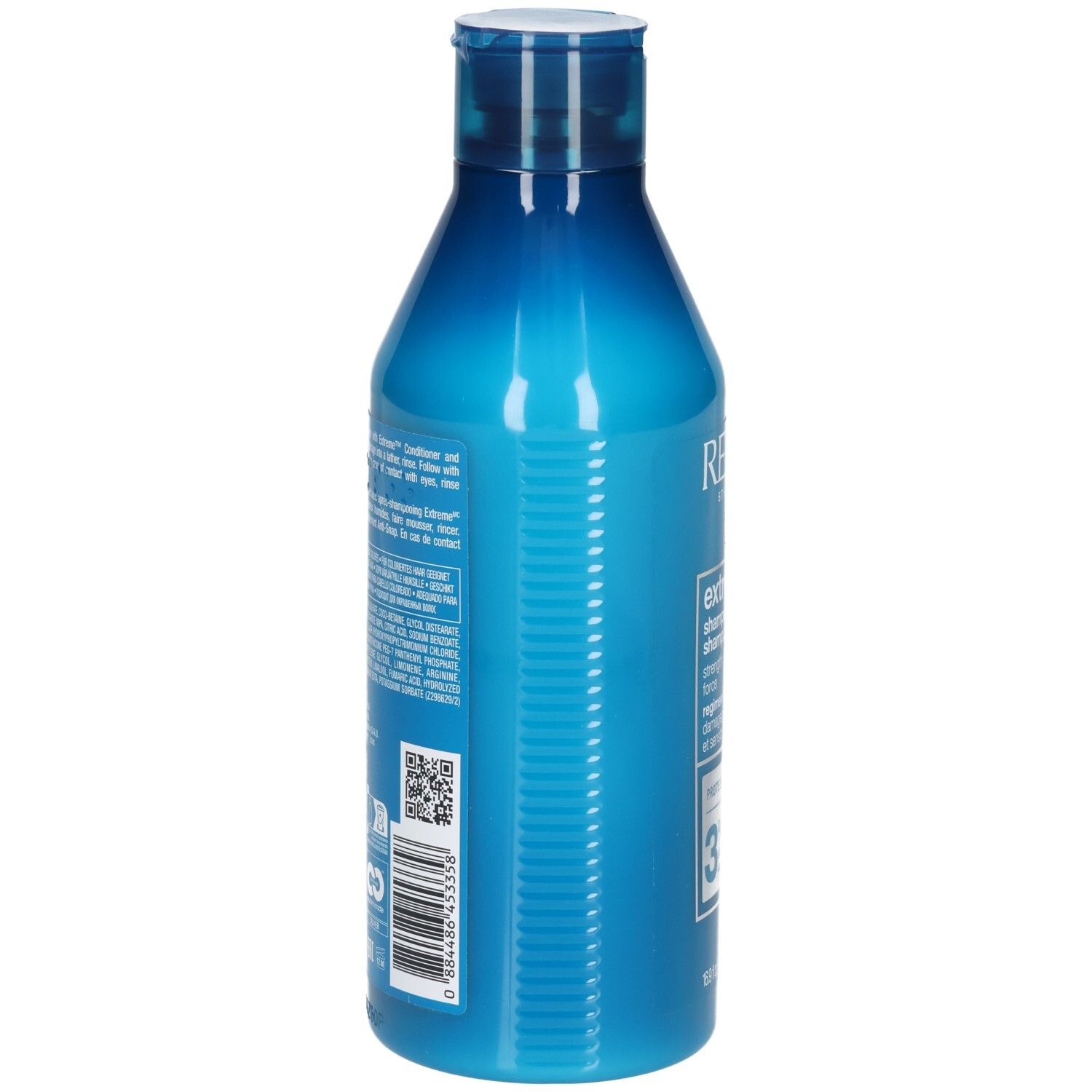 Flacon de shampooing bleu. Dos avec texte et code-barres. Contient des informations sur les ingrédients et le fabricant.
