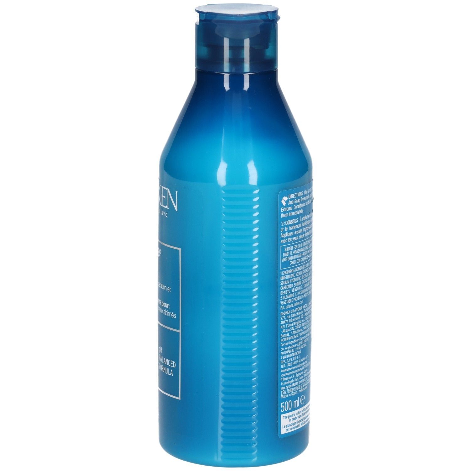 Flacon de shampooing bleu. Côté avec texte. Contient des informations sur le produit et la marque.