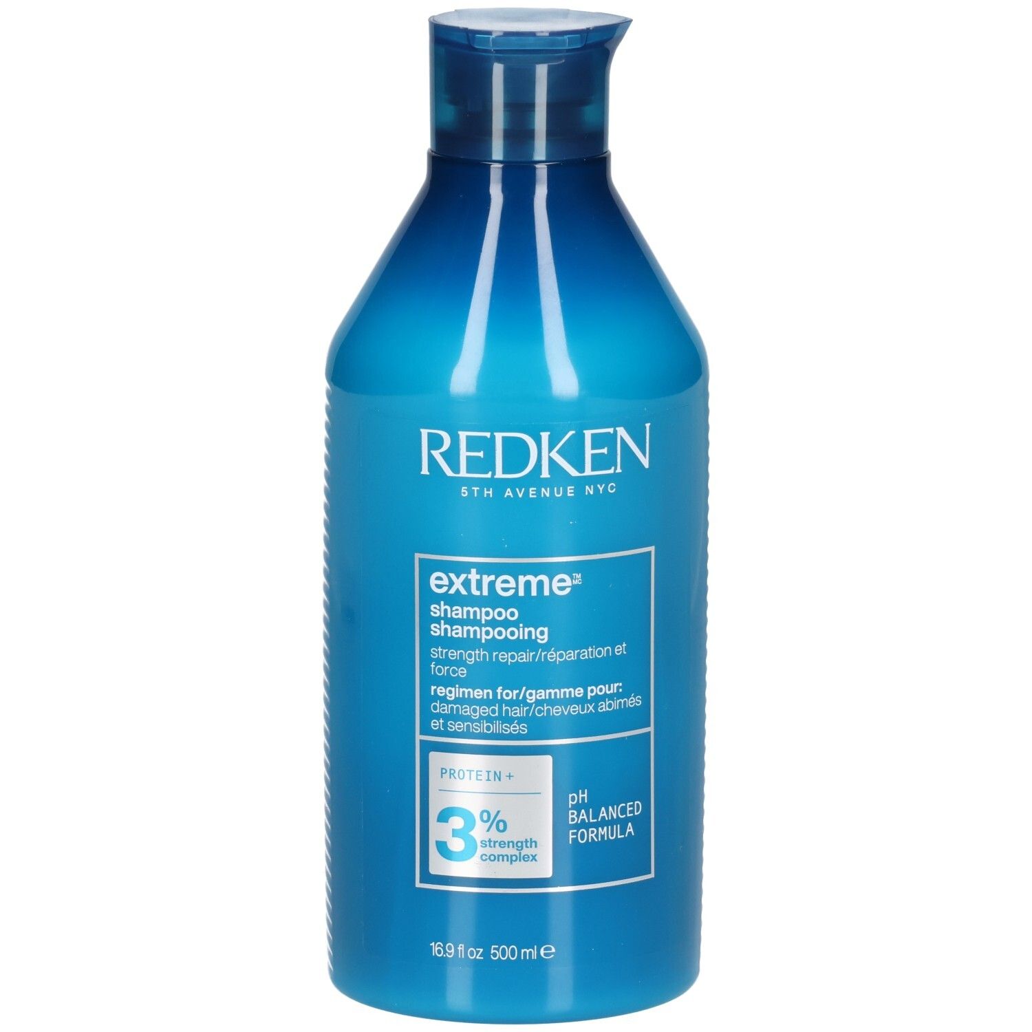 Flacon de shampooing bleu. Inscriptions: Redken, extreme shampoo, 3% strength complex, pH balanced formula. 500ml.