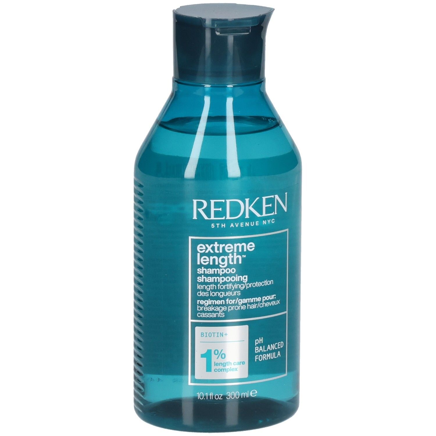 Flacon de shampooing bleu transparent. Inscription : Redken, Extreme Length Shampoo. Contient de la biotine. Formule pH équilibré.