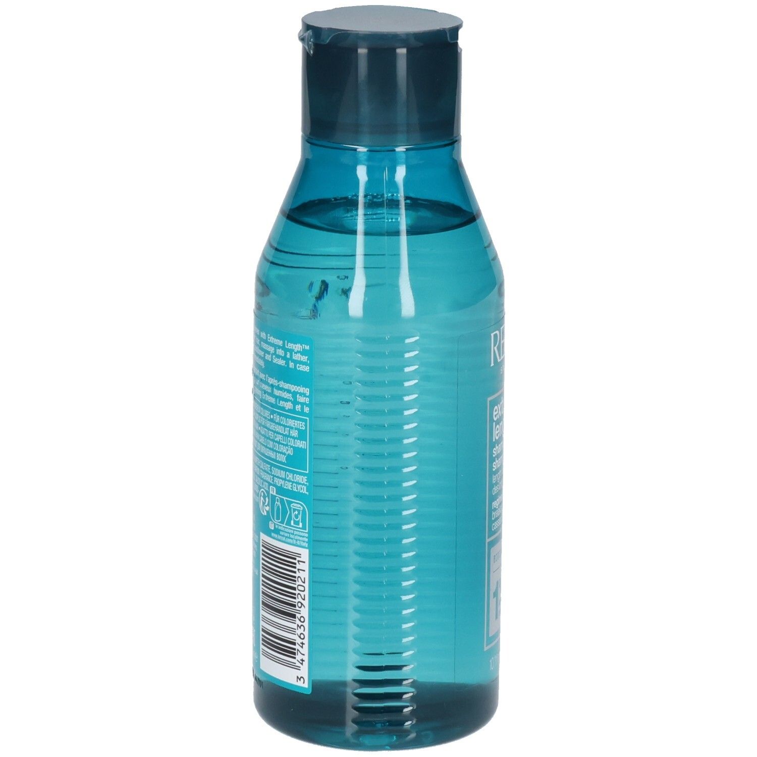 Dos d'un flacon de shampooing bleu transparent. Code-barres et texte. Contient des ingrédients et des instructions.