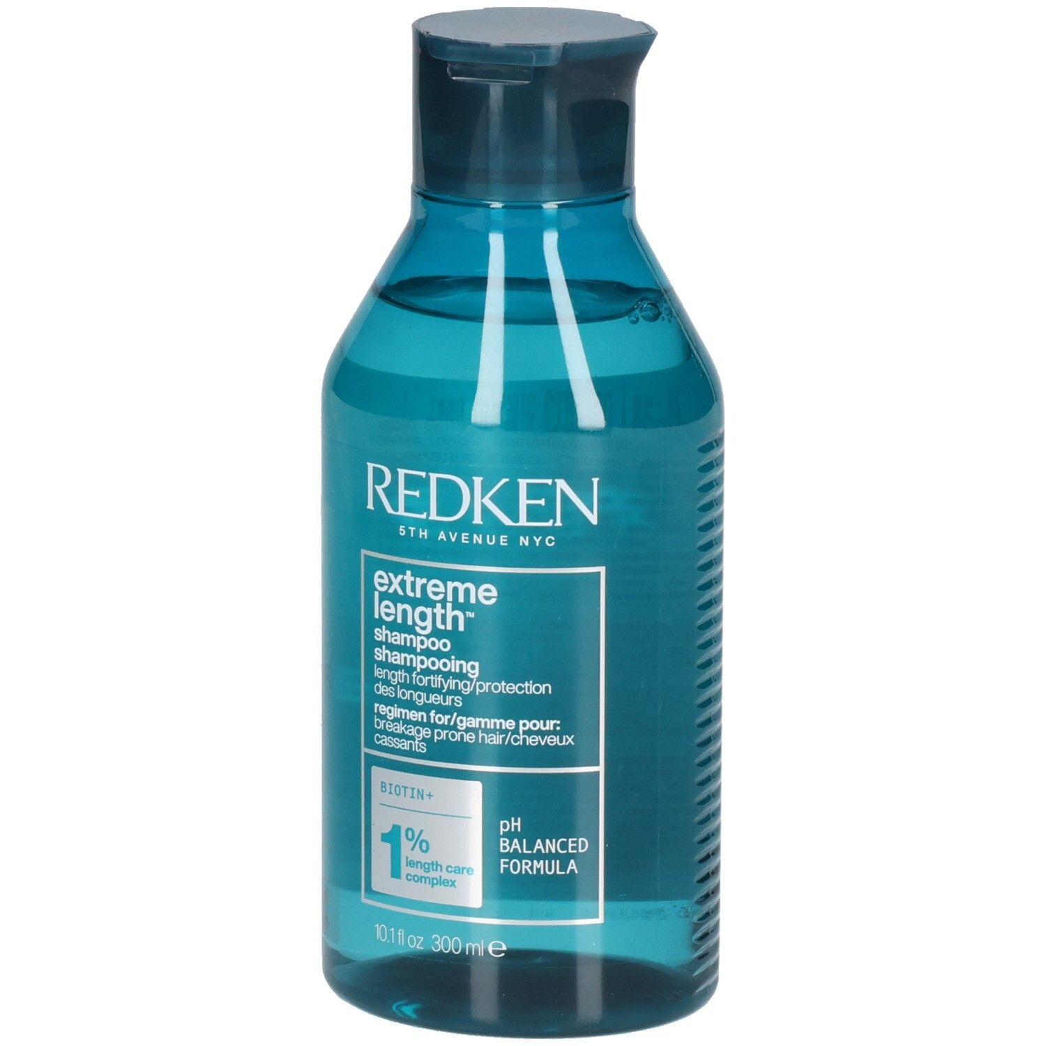 Flacon de shampooing bleu transparent. Inscription : Redken, Extreme Length Shampoo. Contient de la biotine. Formule pH équilibré.