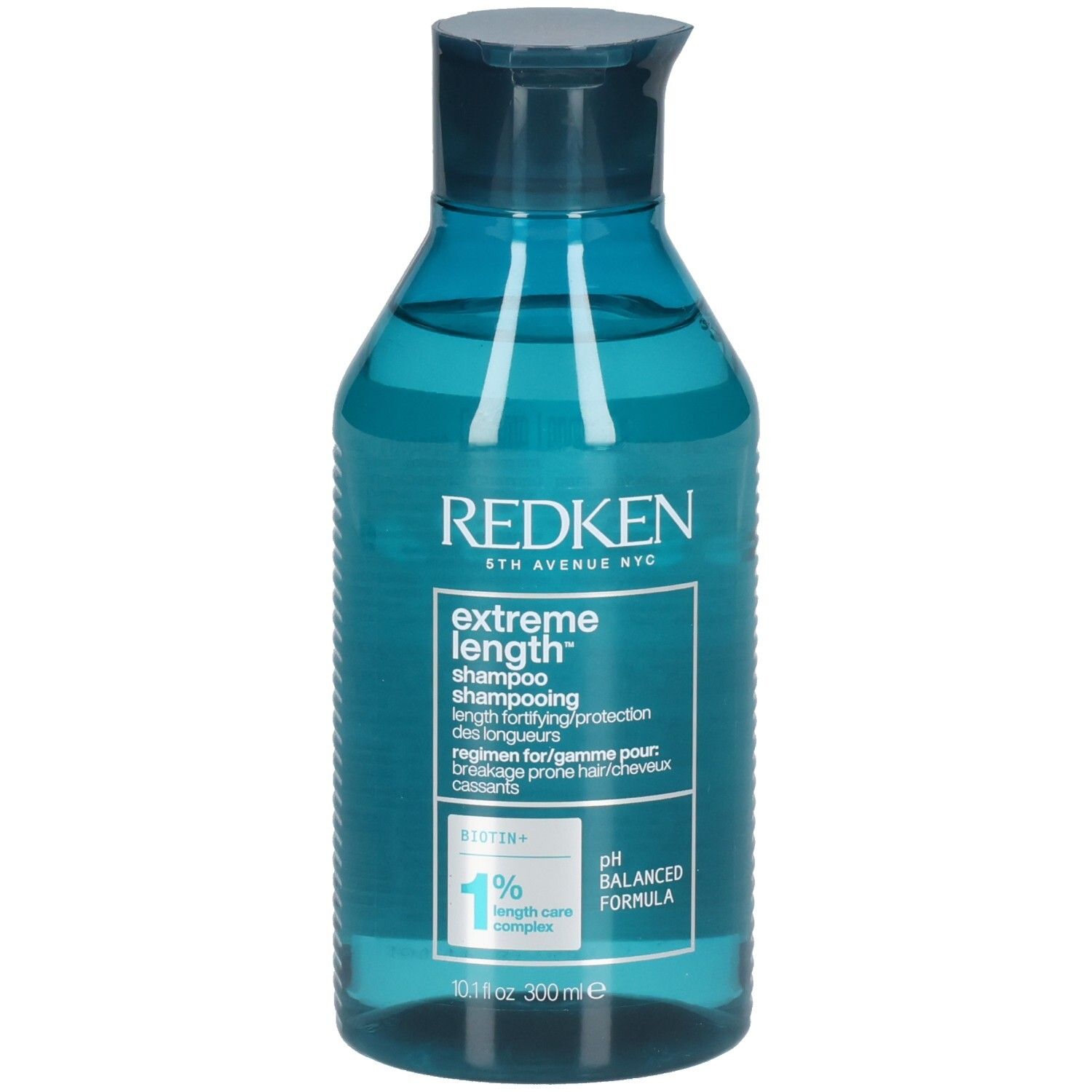 Flacon de shampooing bleu transparent. Inscription : Redken, Extreme Length Shampoo. Contient de la biotine. Formule pH équilibré.