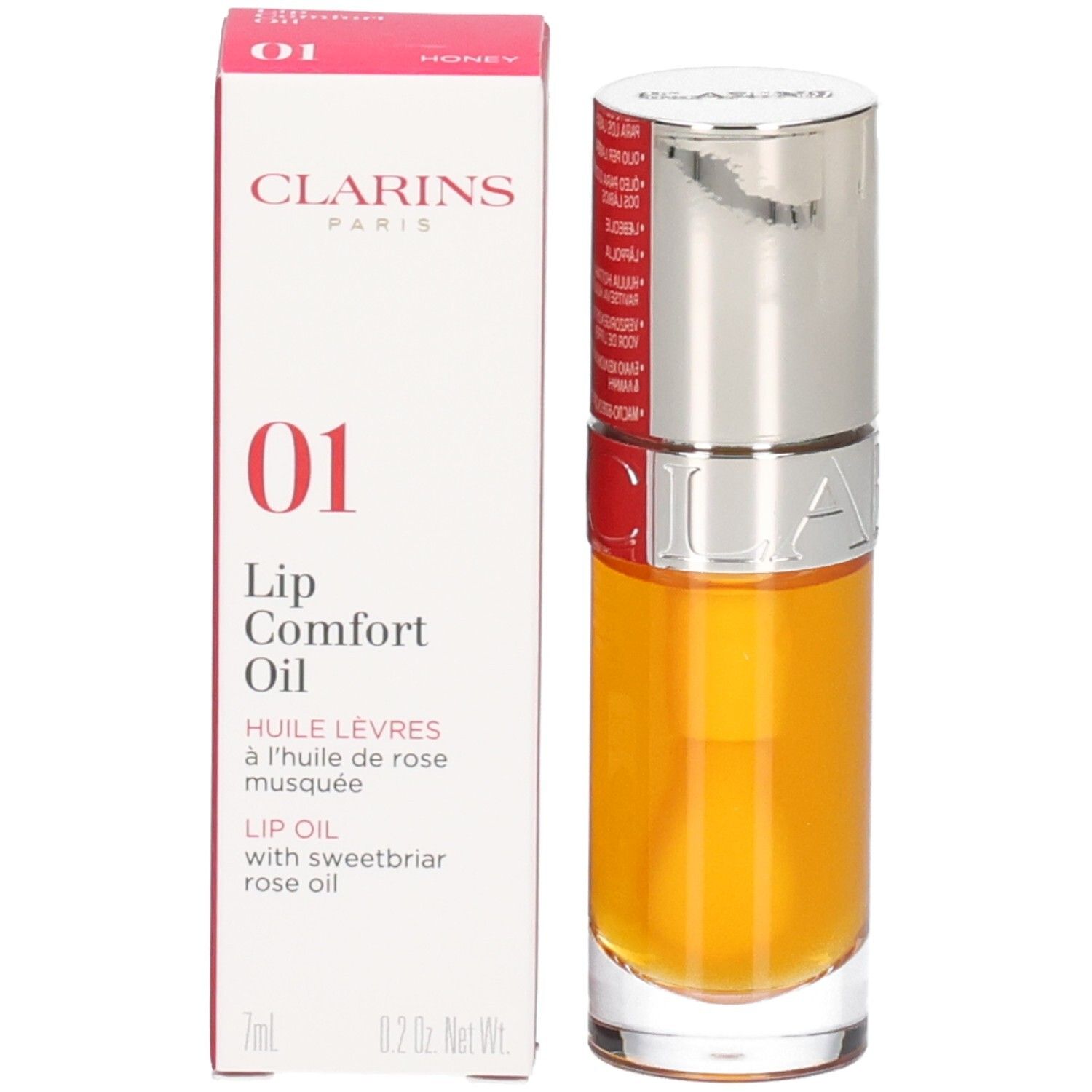 Clarins Lip Comfort Oil 01 - Honey et son emballage. Le flacon a un capuchon argenté.