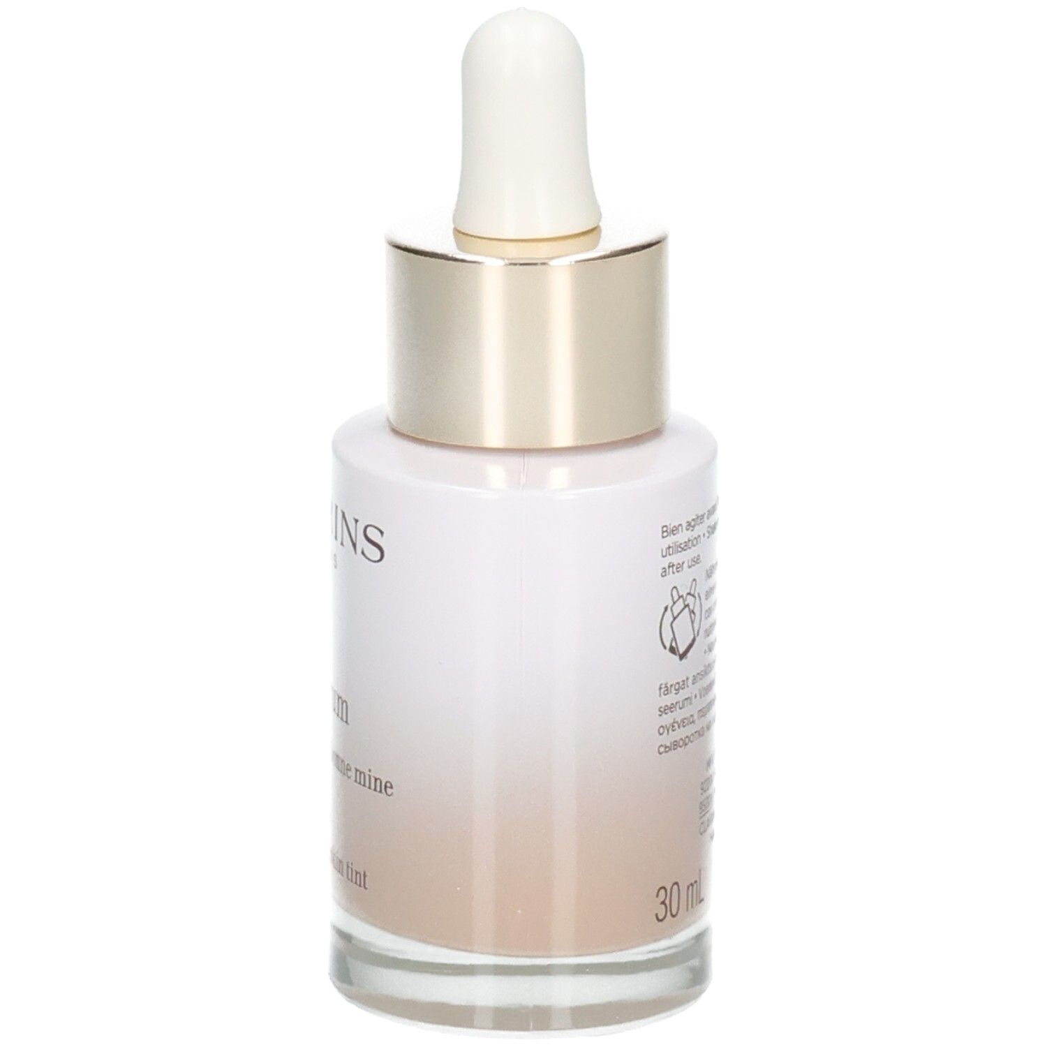 Flacon Clarins Tinted Oleo-Serum avec pipette, côté avec instructions d'utilisation et indication de volume 30ml.