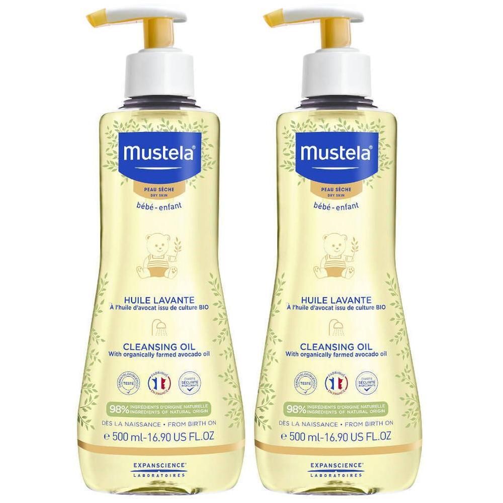 Deux flacons d'huile lavante Mustela avec pompe jaune. Inscription: HUILE LAVANTE, CLEANSING OIL. Contient 98% d'ingrédients d'origine naturelle.
