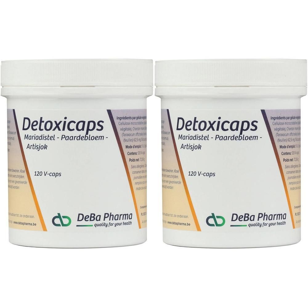 Deux pots blancs avec couvercles. Inscription Detoxicaps, Mariadistel, Paardebloem, Artisjok. 120 V-caps. Logo DeBa Pharma.