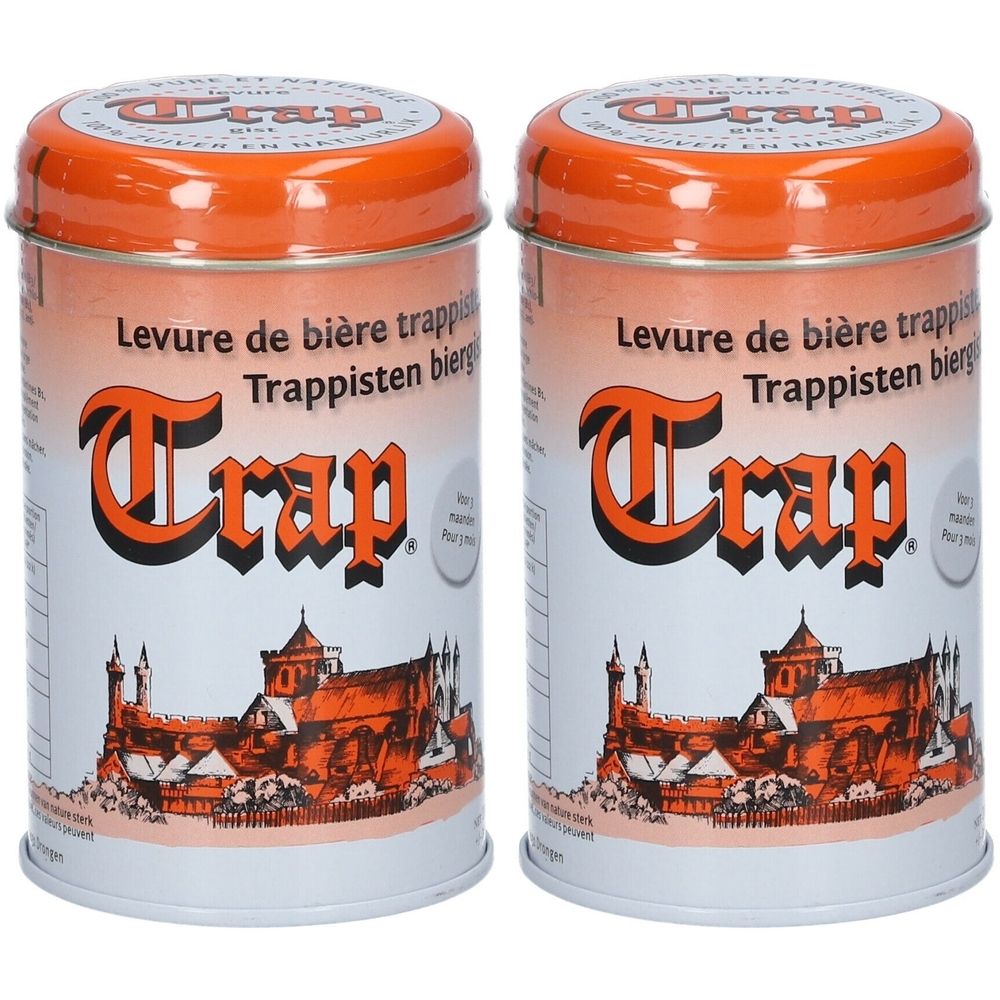 Deux boîtes de Trap Levure de bière trappistes. Couvercle orange, fond blanc avec texte et image d'un bâtiment.