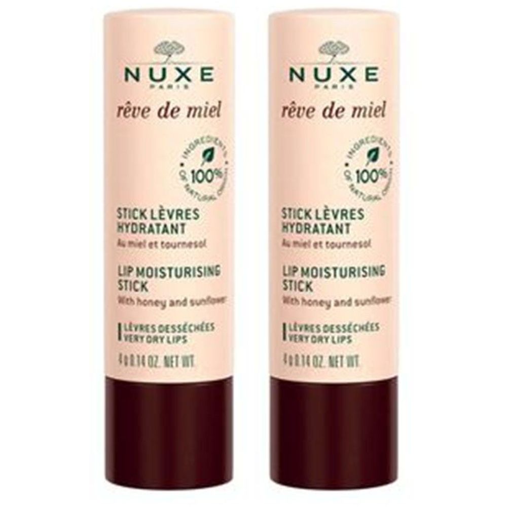 Deux sticks hydratants pour les lèvres Nuxe Rêve de Miel. Un cercle jaune avec 1+1. Inscription: Stick Lèvres Hydratant, Lip Moisturising Stick.