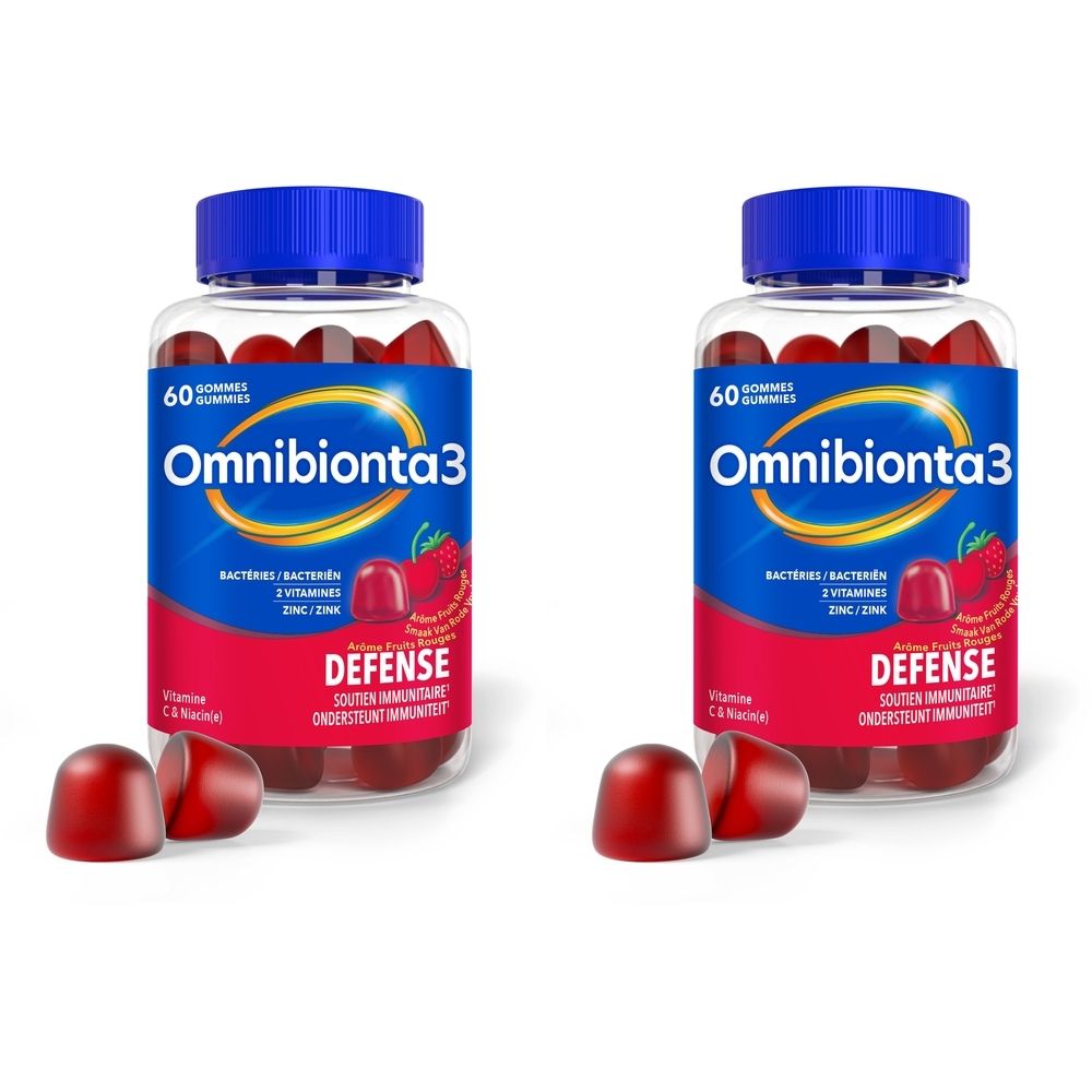 Deux flacons de gummies Omnibionta3 avec offre 1+1. Bouchons bleus, contenants transparents avec gommes rouges. Inscription: Defense, 60 gommes.