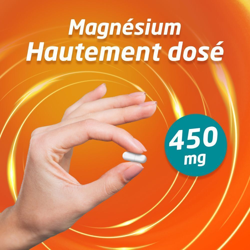 Main tenant une capsule blanche. Texte: Magnésium Hautement dosé 450 mg.
