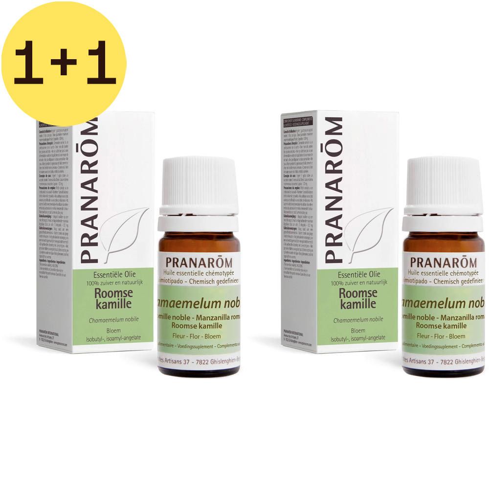 Deux flacons et emballages. Flacons avec bouchon blanc, verre brun. Emballage blanc avec accent vert et texte.