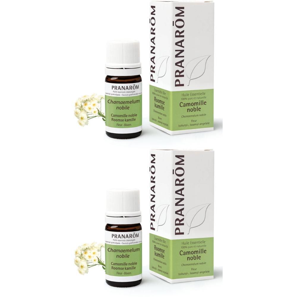 Deux flacons et emballages. Flacons avec bouchon blanc, verre brun. Emballage blanc avec accent vert et texte.