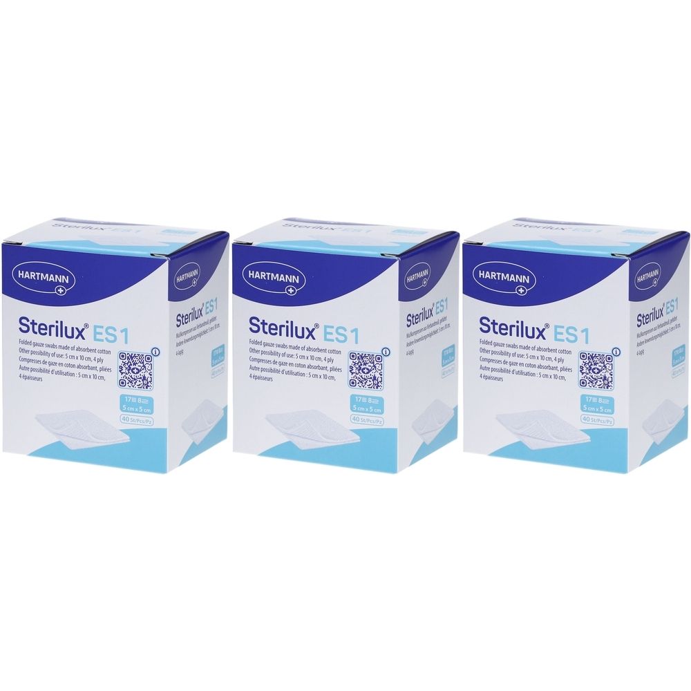 Trois boîtes de compresses Hartmann Stérilux ES1. Emballage bleu et blanc avec nom du produit et code QR. Compresses visibles.