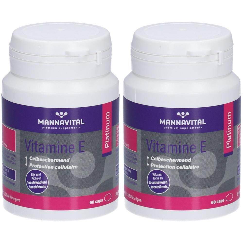 Deux flacons de MannaVital Vitamine E Platinum. Flacons blancs avec étiquettes violettes et roses. Inscription: Vitamine E, 60 caps.