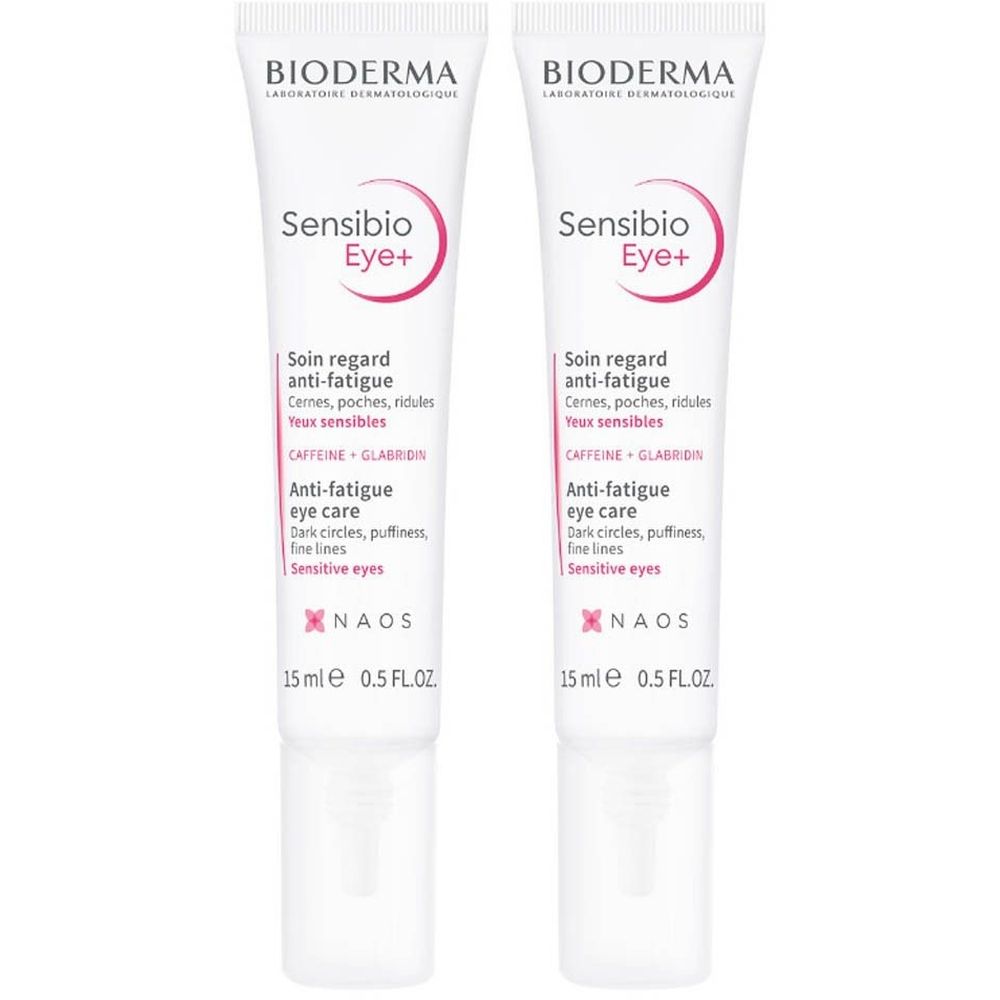 Deux tubes de Bioderma Sensibio Eye+ Soin Regard Anti-Fatigue. Tubes blancs, textes roses et noirs. 15 ml.