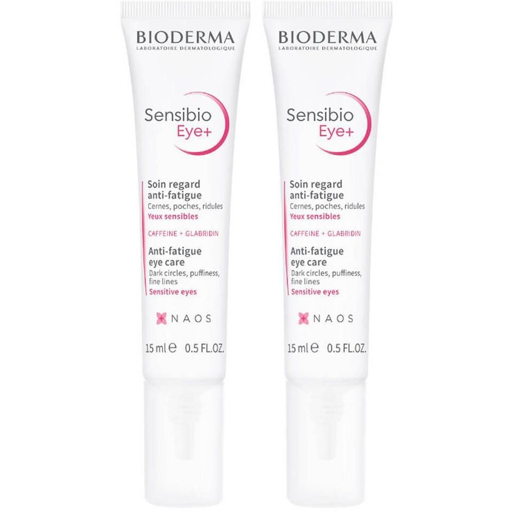 Deux tubes de Bioderma Sensibio Eye+ Soin Regard Anti-Fatigue. Tubes blancs, textes roses et noirs. 15 ml.