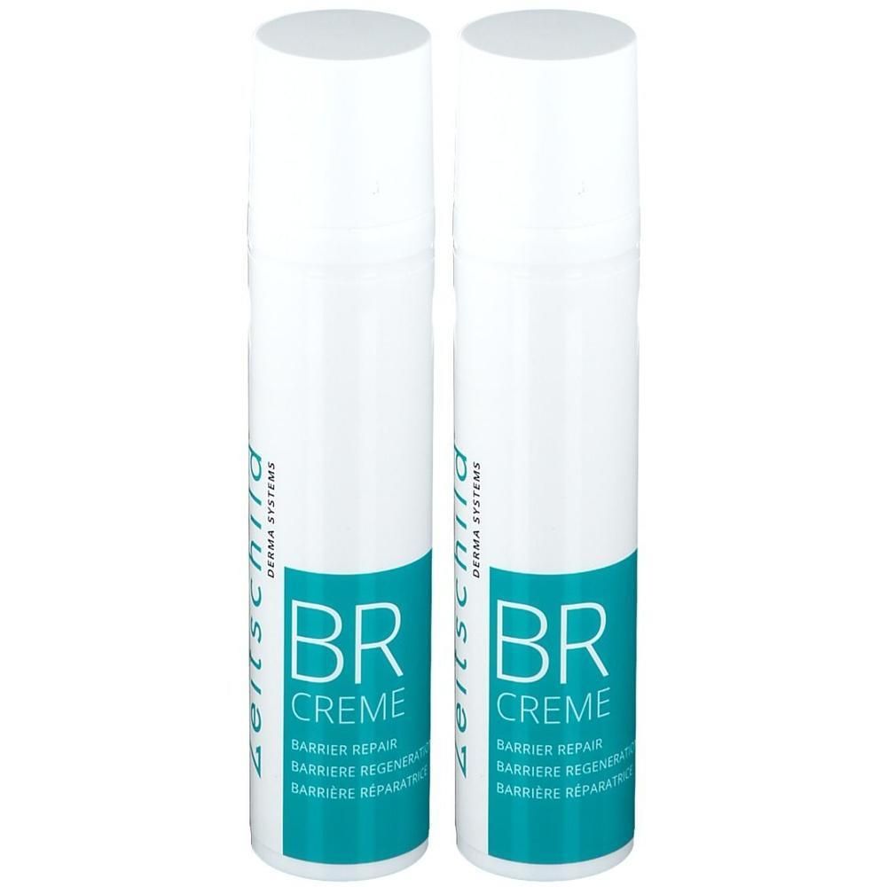 Deux flacons pulvérisateurs blancs avec étiquette bleue. Inscription: BR Crème, Réparation Barrière. Logo Zeitschild Derma Systems.