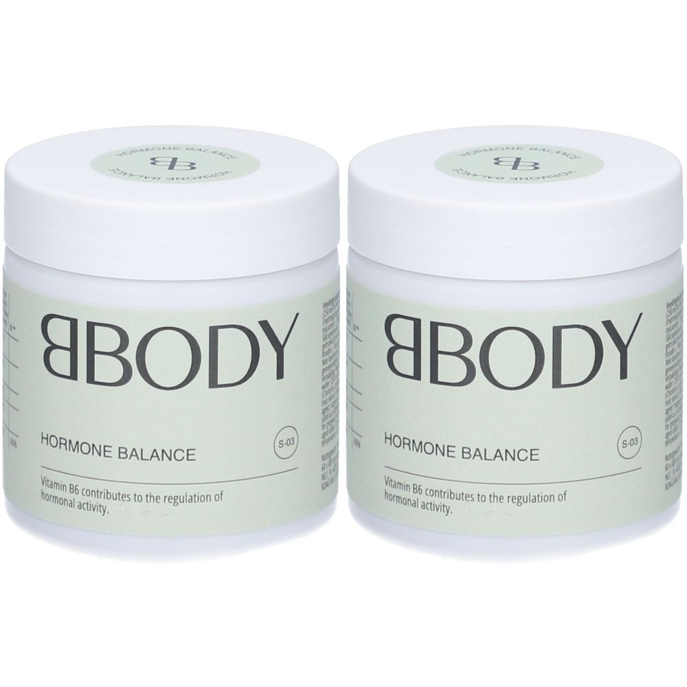 Deux pots blancs avec couvercles verts. Inscription: BBODY Hormon Balance. Texte: La vitamine B6 contribue à la régulation de l'activité hormonale.