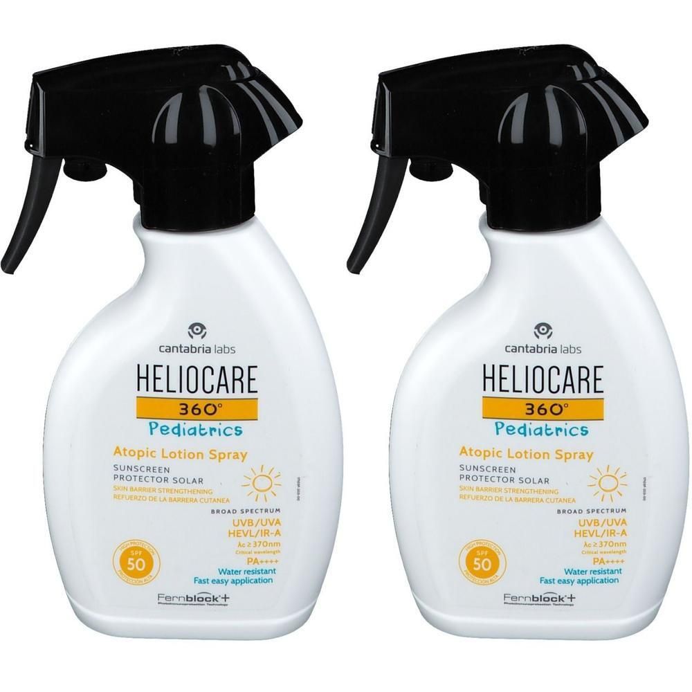 Deux flacons de HELIOCARE 360° Pediatrics Atopic Lotion Spray SPF50. Flacons blancs avec pulvérisateur noir. Indication SPF50 jaune.