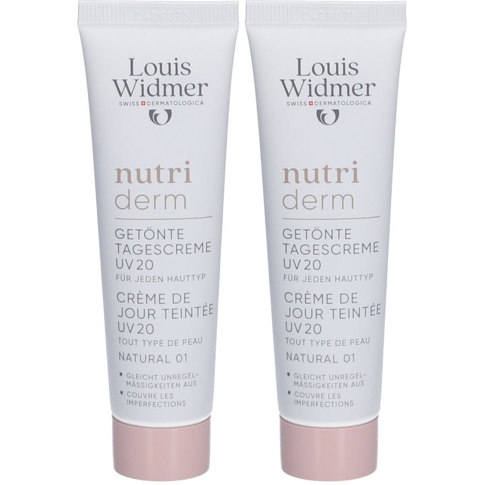 Deux tubes de crème de jour teintée Louis Widmer Nutriderm UV20 Natural 01. Tubes blancs avec texte et bouchon rose.