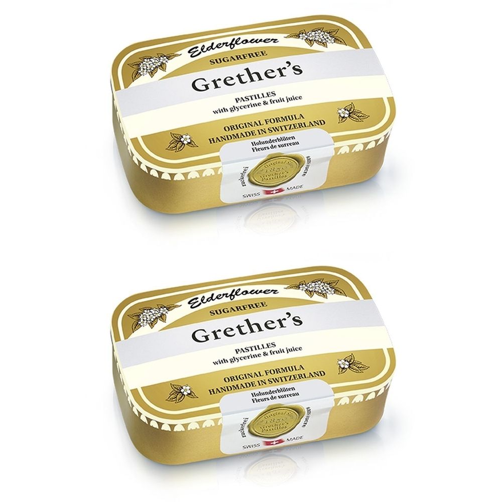 Deux boîtes de pastilles dorées. Inscription : Grether's Pastilles, Elderflower, sans sucre. Fabriqué en Suisse.