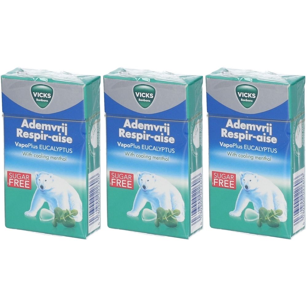 Trois boîtes Vicks Respirer Librement Sans Sucre. Emballage bleu et vert avec illustration d'ours polaire et texte.
