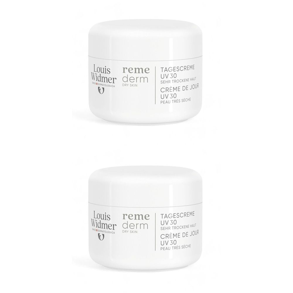 Deux pots de crème blancs avec couvercles. Inscription: Louis Widmer Remederm Dry Skin Crème Visage UV30. Logo et texte.