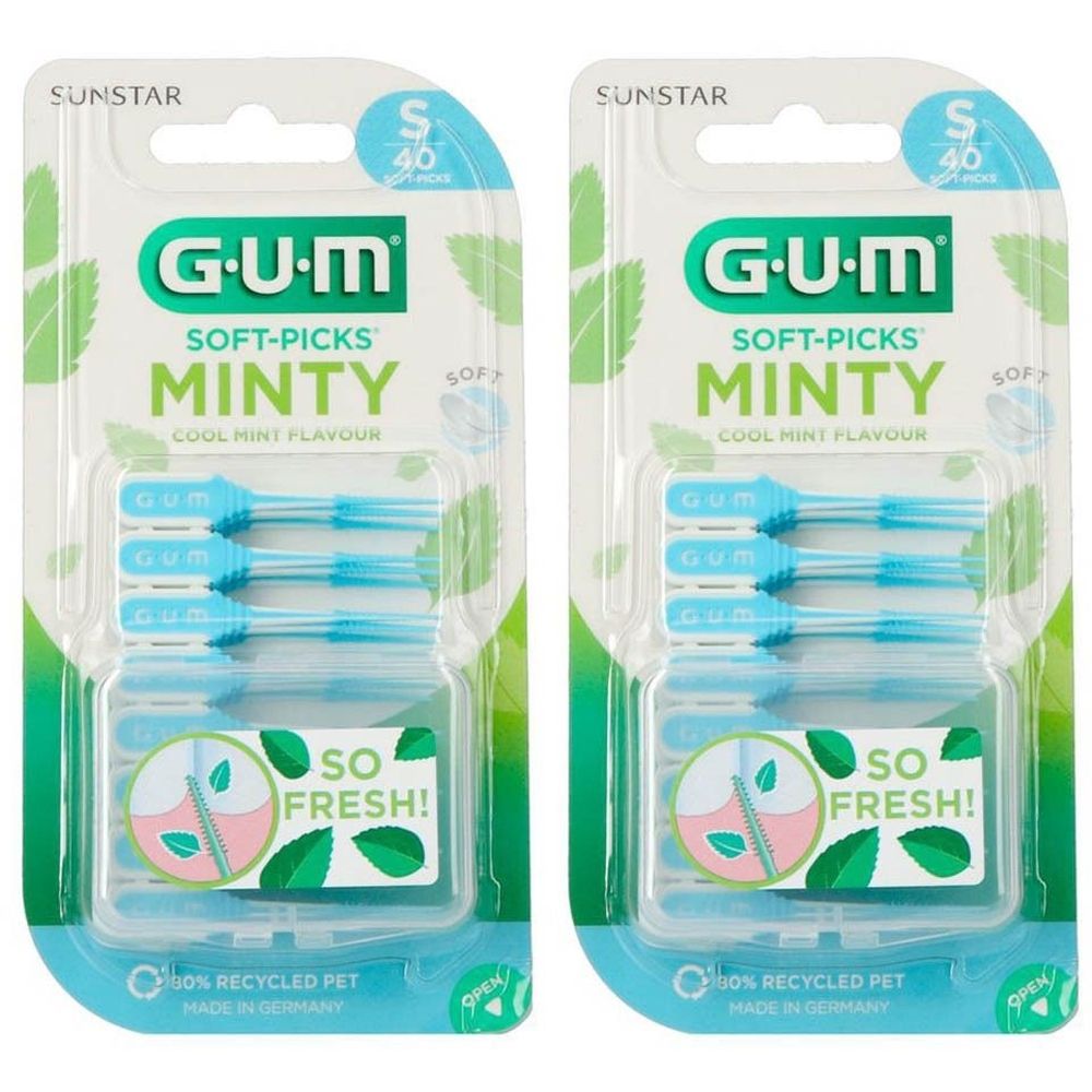 Deux paquets de GUM Soft-Picks Minty, petite taille, 40 pièces. Pics bleu clair dans des blisters transparents, emballage vert.