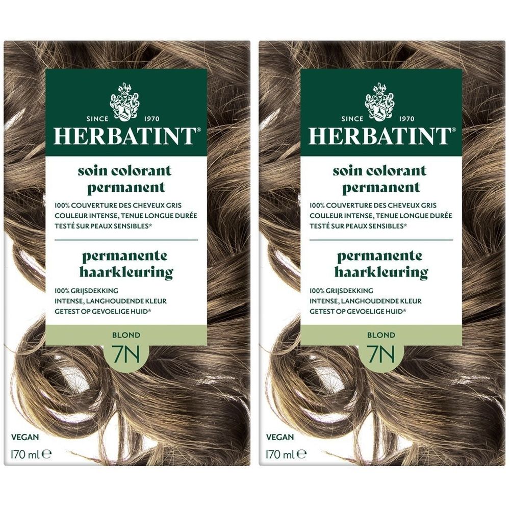 Deux boîtes Herbatint Soin Coloration Permanente 7N Blond. Emballage vert-brun avec informations et illustration de cheveux.