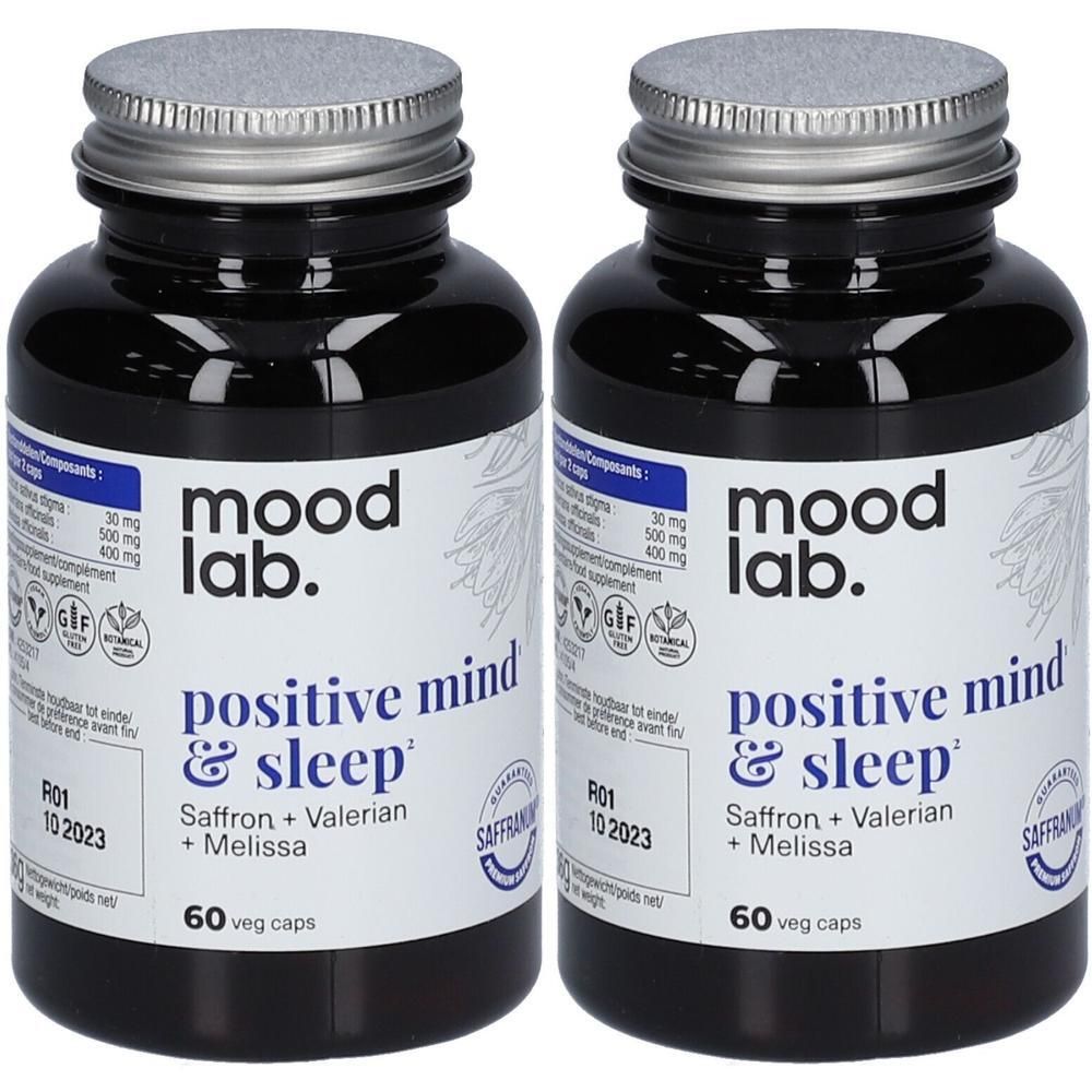 Deux flacons de MOODLAB, positive mind & sleep. Bouteilles en verre noir avec couvercles argentés et étiquettes d'informations.