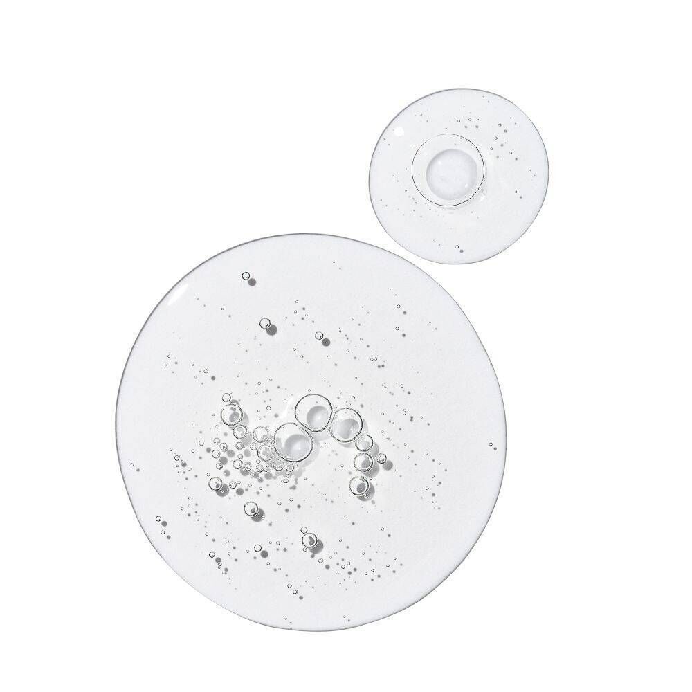 Gouttes de The Ordinary Multi-Peptide Eye Serum avec bulles d'air.