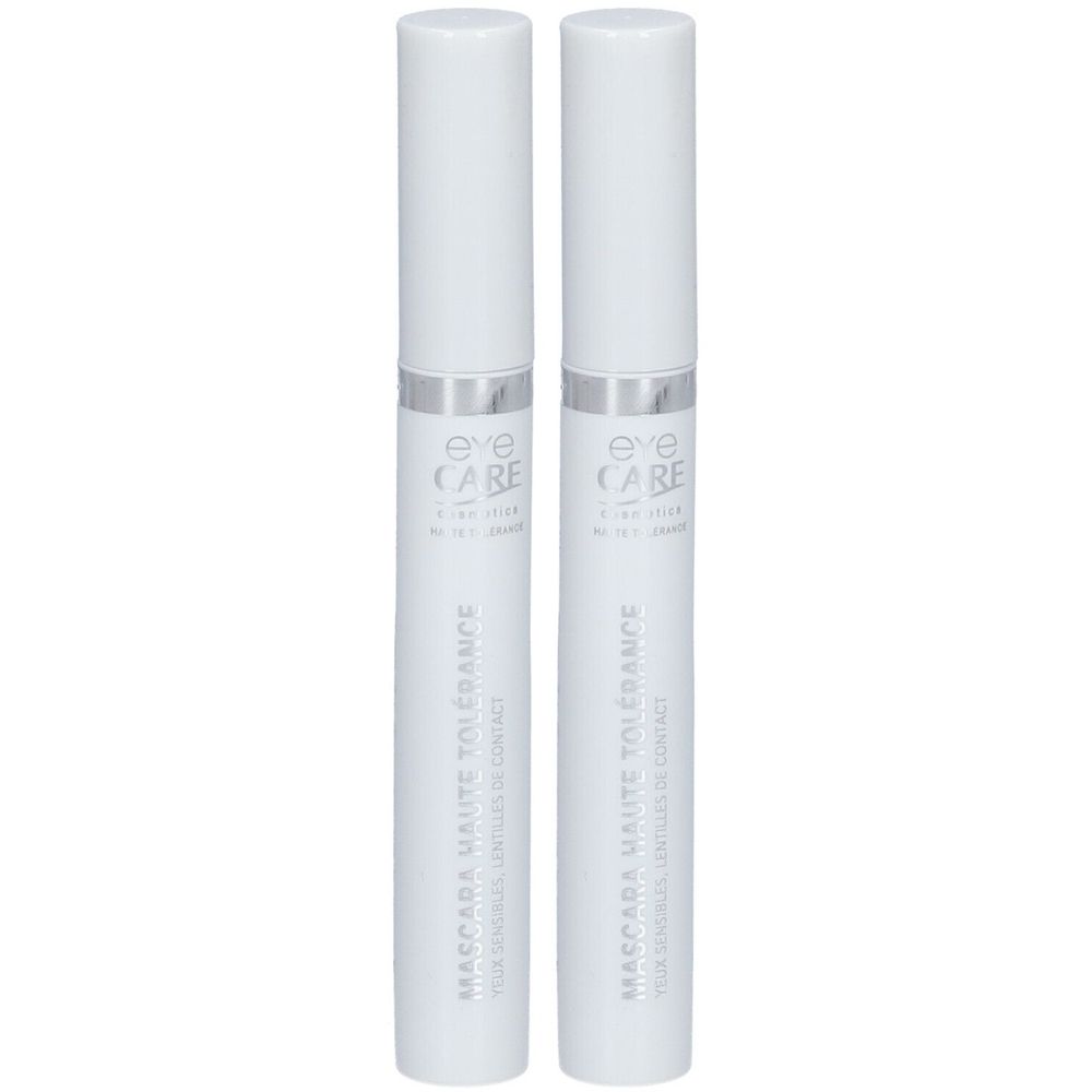 Deux tubes de mascara blancs avec bagues argentées et bouchons blancs. Inscription: Eye Care Cosmetics, Mascara Haute Tolérance.