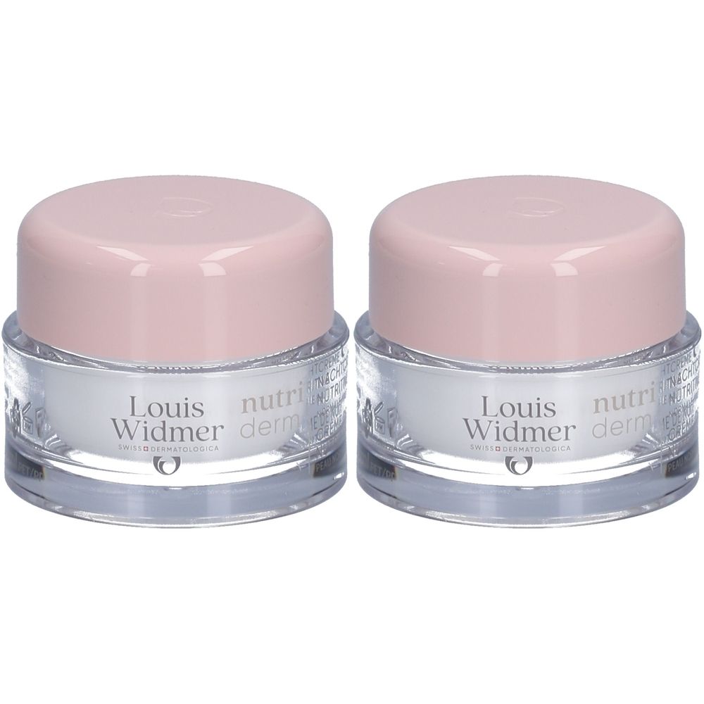 Deux pots de crème de nuit Louis Widmer Nutriderm. Pots transparents, couvercles roses. Inscriptions sur le devant.
